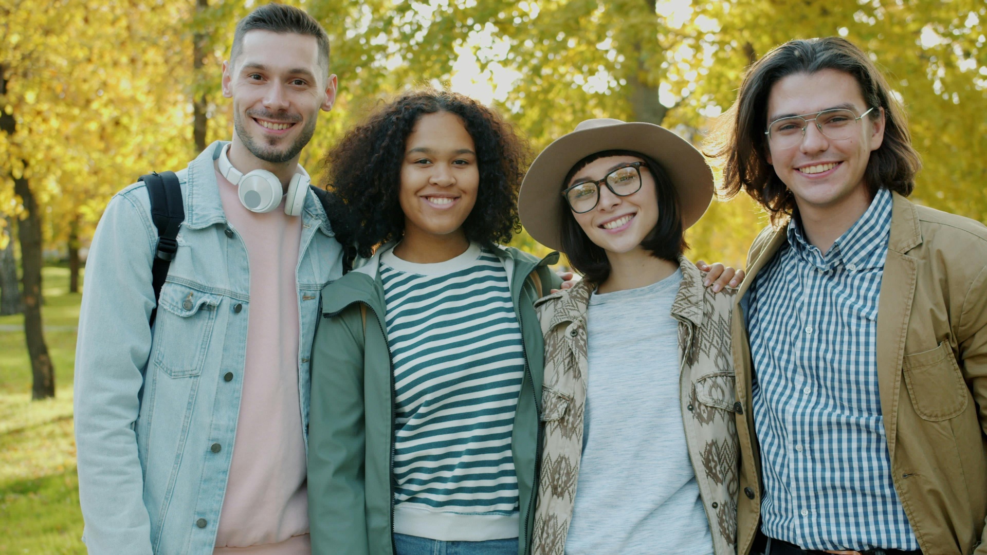 Diverse group of students smiling outdoors
